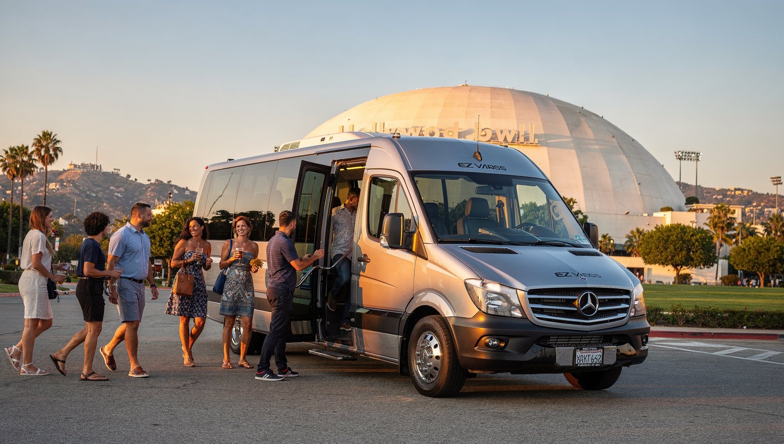 Charter shuttle for Hollywood Bowl group transportation arriving on Highland Avenue at golden hour
